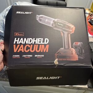 New In Box Handheld Vacuum - Black 2 Batteries And All Attachments Plus Case